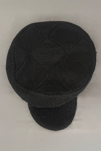 Top view of 1940s vintage black diamond checkboard cordé tilt topper hat. Showing the diamond checkboard pattern.