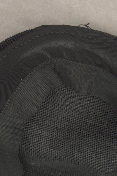 Interior detail view of 1940s vintage black diamond checkboard cordé tilt topper hat. Showing the New York Creations label.