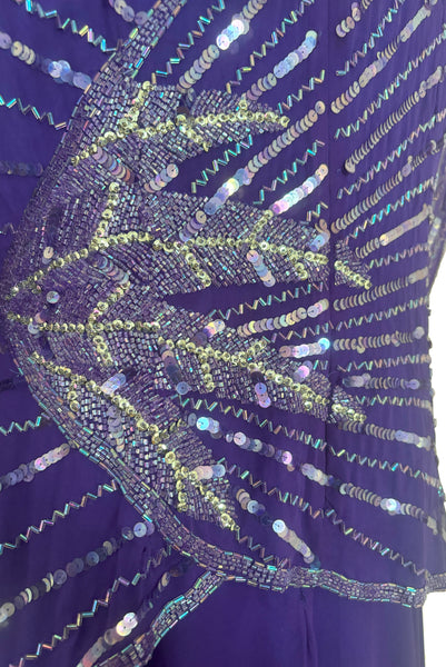 Side top detail view of 1980s vintage beaded purple silk & rayon blouse and drop waist dress Set by Nite Line, small to medium. Showing the iridescent purple sequins and glass beading.