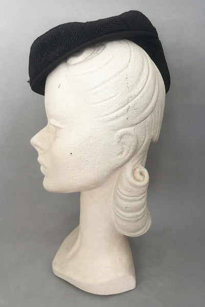 Side view of 1940s vintage black diamond checkboard cordé tilt topper hat.