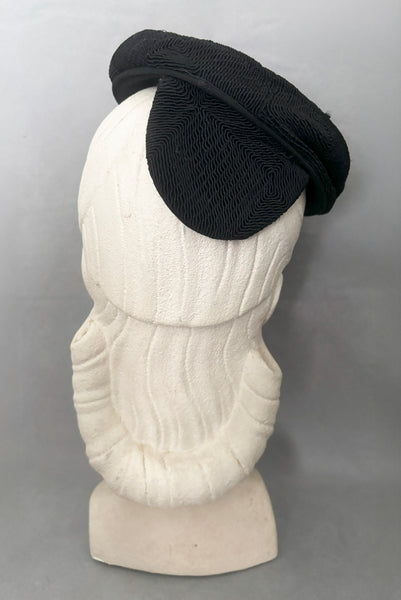Back view of 1940s vintage black diamond checkboard cordé tilt topper hat.