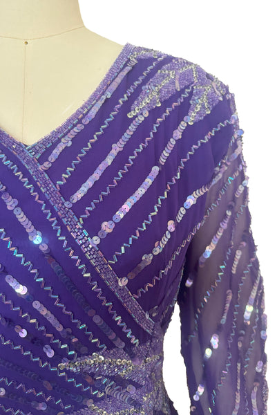 Front top detail view of 1980s vintage beaded purple silk & rayon blouse and drop waist dress Set by Nite Line, small to medium. Showing the iridescent purple sequins and glass beading.