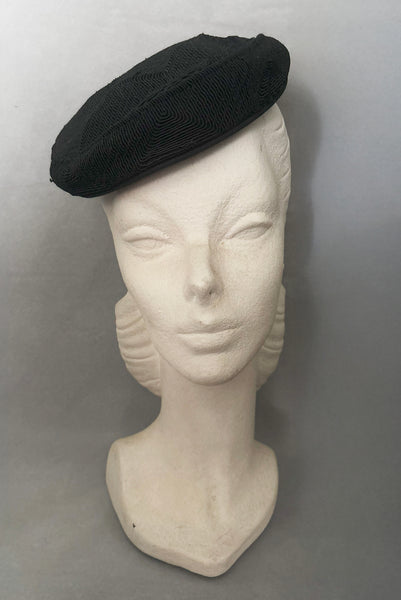 Front view of 1940s vintage black diamond checkboard cordé tilt topper hat.