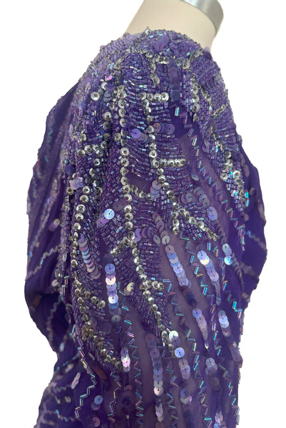 Shoulder top detail view of 1980s vintage beaded purple silk & rayon blouse and drop waist dress Set by Nite Line, small to medium. Showing the iridescent purple sequins and glass beading.