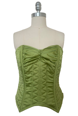 Front view of 1990s vintage peridot green quilted satin corset/bustier by John Festa, small to medium. New without tags.