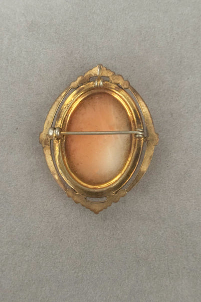 Vertical back view of 1920s vintage pink and white carved shell women's head figural carved cameo brooch pendant in 12k gold fill setting.