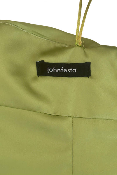 Interior detail view of 1990s vintage peridot green quilted satin corset/bustier by John Festa, small to medium. New without tags. Showing the John Festa label.