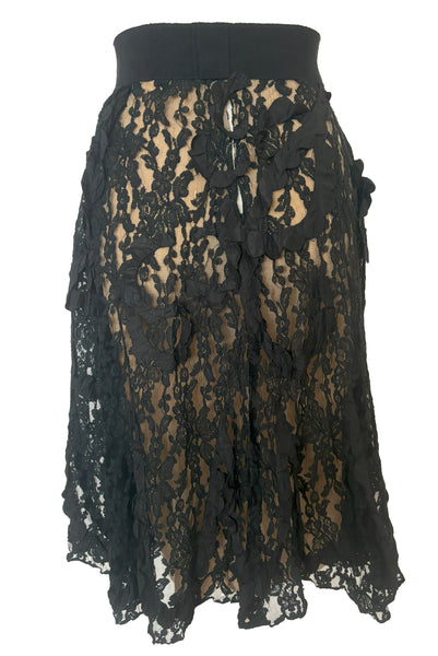 Front view of 1990s vintage goth sheer black lace and taffeta nude look skirt, medium to large.