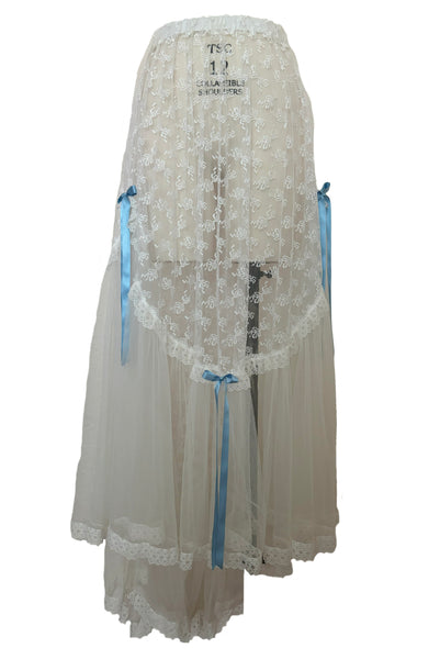 Front view of 1980s vintage sheer white lace & tulle skirt with train, trimmed with blue satin ribbon bows, small, medium, large.