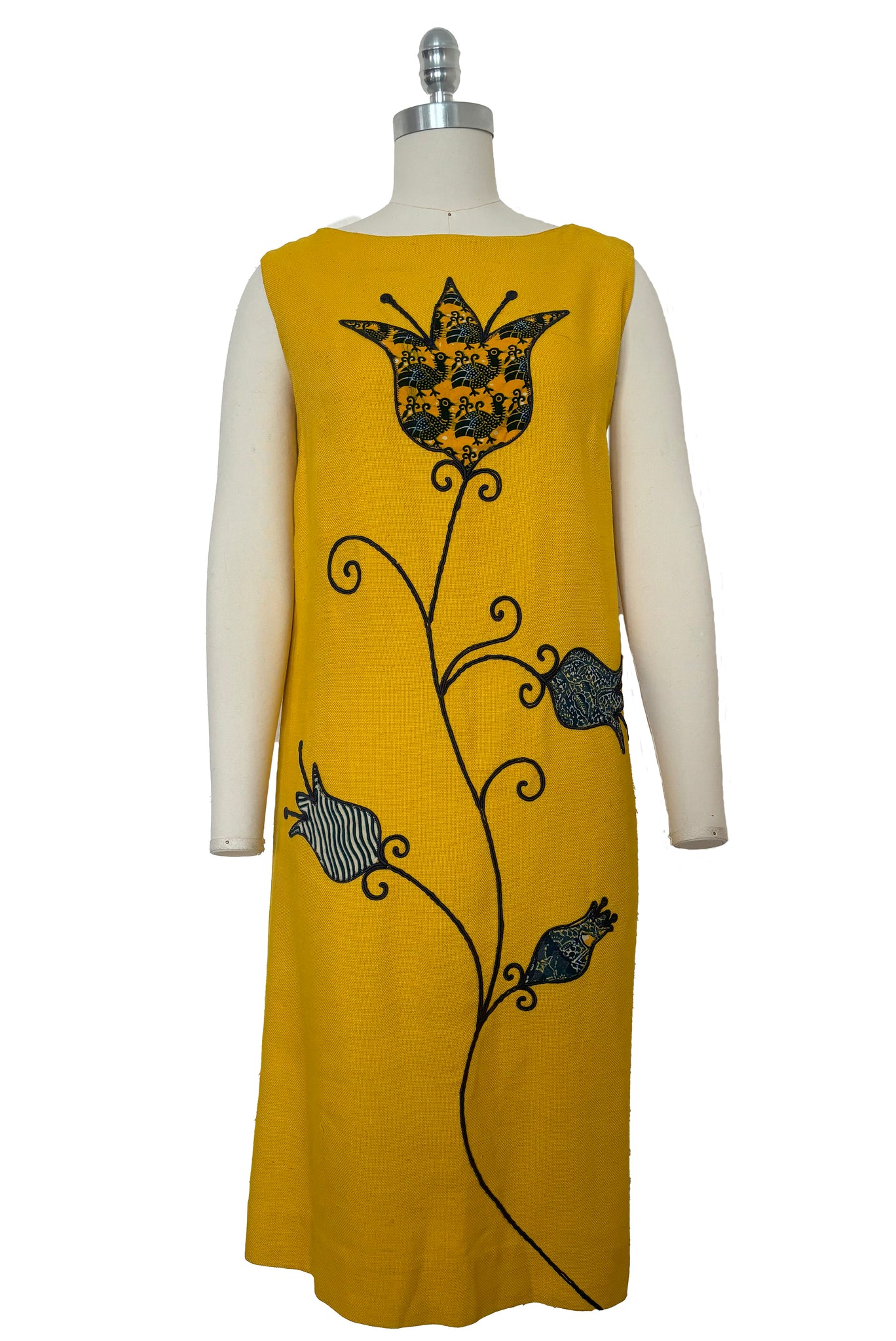 Front view of 1960s vintage mustard yellow silk suiting shift dress with navy blue, white, & yellow tulip appliques and embroidery by Crazy Horse, small to medium.