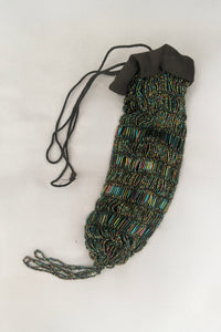 Vertical view of 1910s turn of the century vintage Edwardian black peacock iridescent glass beaded drawstring handbag.