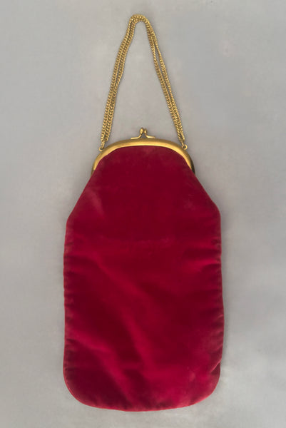 Vertical front view of 1960s vintage rose pink velvet evening handbag with gold frame and chain handle, by Morris Moskowitz.