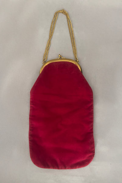 Vertical back view of 1960s vintage rose pink velvet evening handbag with gold frame and chain handle, by Morris Moskowitz.