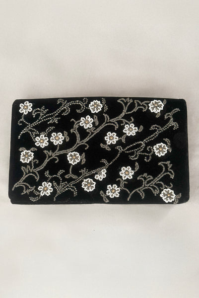 Vertical front view of 1950s vintage black velvet floral silver and white glass and faux cream pearl beaded clutch evening bag.