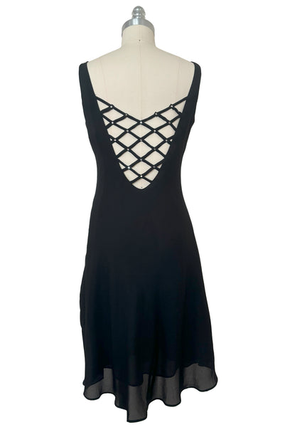 Back view of 1990s black slip dress with rhinestone lattice back dress by Niki, extra small to small.