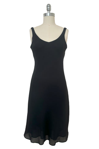 Front view of 1990s black slip dress with rhinestone lattice back dress by Niki, extra small to small. Showing the wide v-neckline.