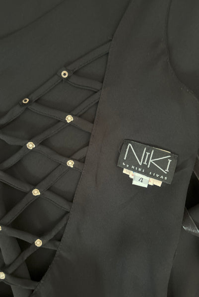 Interior detail of 1990s black slip dress with rhinestone lattice back dress by Niki, extra small to small. Showing the tag and label as well as a interior view of the open lattice back.