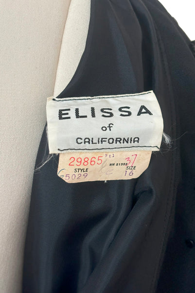 Interior detail view of 1960s vintage black fringe beaded and sequin boat neckline with standing collar cocktail dress by Elissa of California, medium to large. Showing label and size 16 tag.