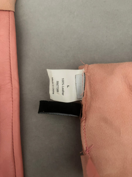 Interior detail view of 2000s y2k vintage pink leather unlined opera gloves with snap wrists, by J.Crew, size L. Showing the size L tag.