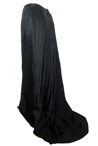 Side view of 1900s vintage black silk satin beaded mourning skirt, rare size medium to large.