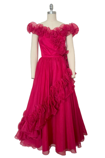 Front view of 1960s vintage hot pink iridescent glitter organza ruffled evening dress by Mike Benet, size extra extra small to extra small.