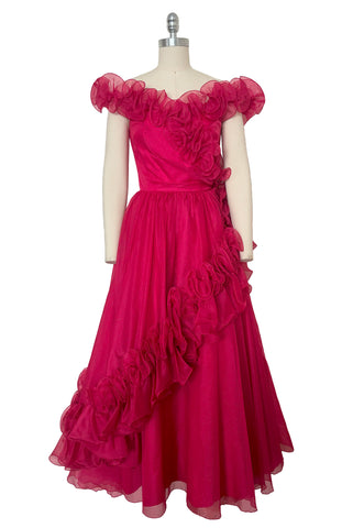 Front view of 1960s vintage hot pink iridescent glitter organza ruffled evening dress by Mike Benet, size extra extra small to extra small.