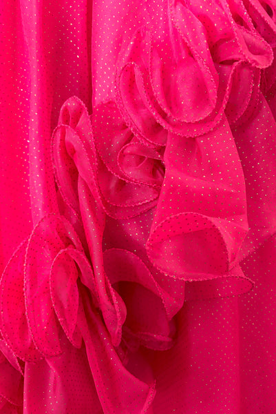 Detail view of 1960s vintage hot pink iridescent glitter organza ruffled evening dress by Mike Benet, size extra extra small to extra small. Showing a close-up of the ruffled organza skirt with iridescent glitter dots.
