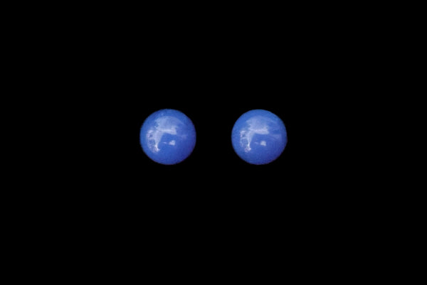Horizontal front view of 1980s vintage bright blue Lucite gumball stud pierced earrings.