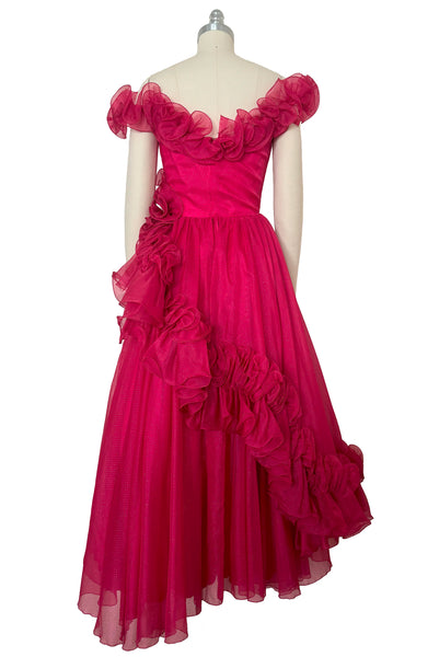Back view of 1960s vintage hot pink iridescent glitter organza ruffled evening dress by Mike Benet, size extra extra small to extra small.