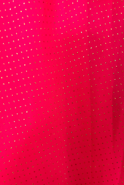 Detail view of 1960s vintage hot pink iridescent glitter organza ruffled evening dress by Mike Benet, size extra extra small to extra small. Showing a close-up of the organza skirt with iridescent glitter dots.