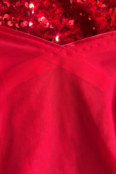Interior detail view of red stretch velvet, sequin embellished dress with satin straps, sweetheart neckline, cold shoulder short sleeves, princess seamed bodice, and pencil skirt.  Showing the inner front of the sweetheart neckline and the seam allowance of the satin bias trim.