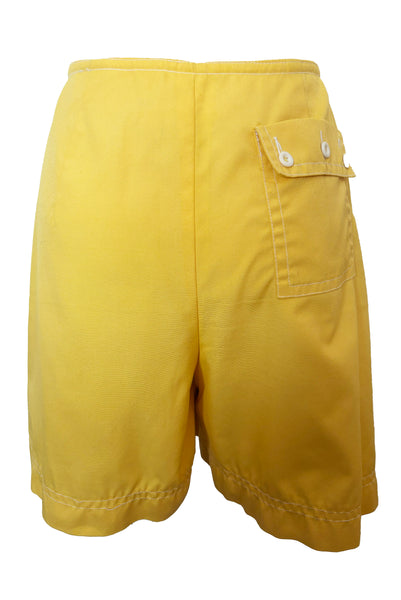 Back view of 1960s vintage Koret of California Koratron yellow fabric skort with white plastic buttons, size medium to large.