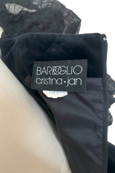 Interior detail view of black wedding dress.  1980s vintage Barboglio black velveteen and windowpane organza mermaid evening gown with puff sleeves, small to medium. Showing the Barboglio Cristina Jan label and tag.