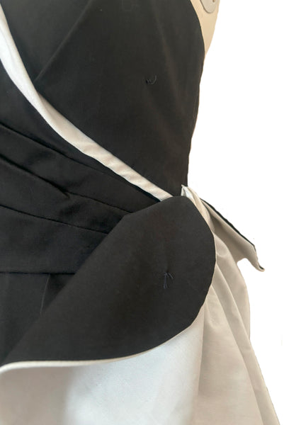 Bodice front detail view of 1990s vintage Victor Costa black and white poly cotton twill wrapped strapless cocktail dress, extra small to small. Showing where the side bow was  once attached to the bodice.