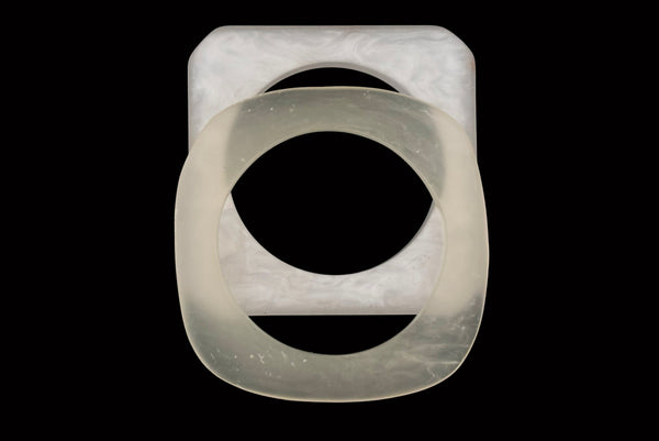 Horizontal top view of 1980s vintage white matte frosted translucent marbled Lucite square bangle bracelet set of two (2).