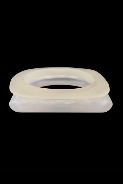 Vertical front view of 1980s vintage white matte frosted translucent marbled Lucite square bangle bracelet set of two (2).