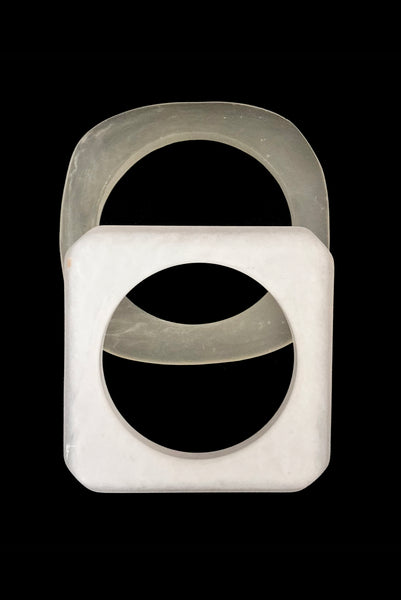 Vertical bottom view of 1980s vintage white matte frosted translucent marbled Lucite square bangle bracelet set of two (2).
