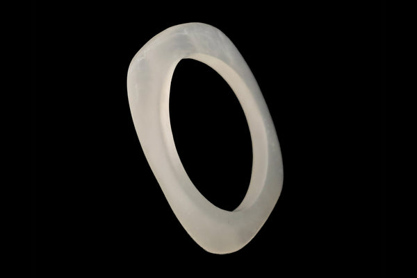 Horizontal rounded single bangle perspective view of 1980s vintage white matte frosted translucent marbled Lucite square bangle bracelet set of two (2).