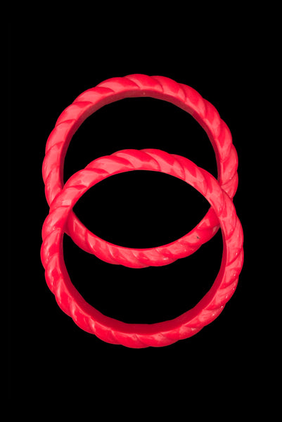 Vertical top view of 1980s vintage red rope plastic bangle bracelet set of two (2).