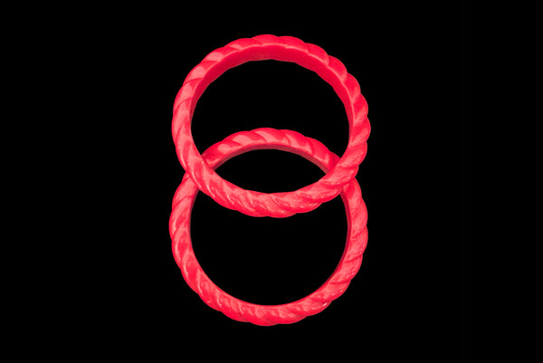 Horizontal bottom view of 1980s vintage red rope plastic bangle bracelet set of two (2).