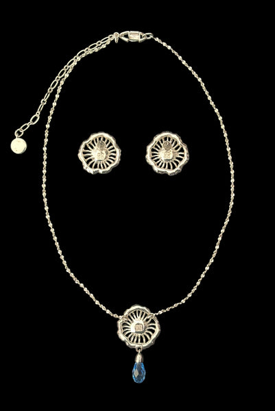 Vertical back view of early 2000s vintage silver tone, blue opaline rhinestone, and crystal floral adjustable necklace and pierced stud earrings jewelry set by Givenchy.