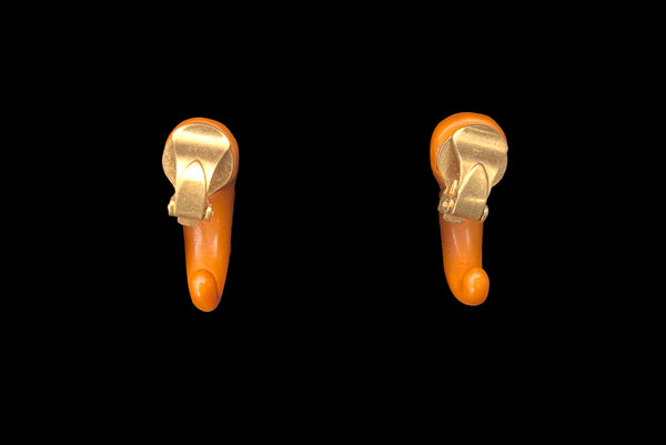 Horizontal back view of 1930s vintage butterscotch French Bakelite half hoop clip-on earrings.