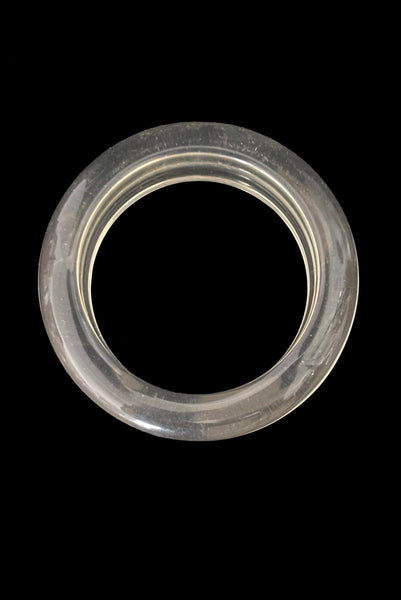 Vertical bottom view of 1980s vintage clear Lucite asymmetrical bangle bracelet.