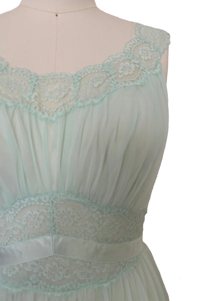 Bodice detail view of 1940s vintage pale aqua blue lace, nylon, and satin ribbon ballerina nightgown by Vanity Fair, small to medium. Showing the scoop neck lace neckline, gathered bust, and lace and ribbon midriff.