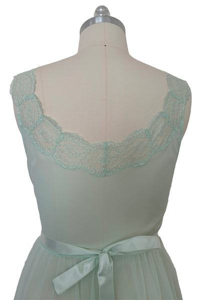 Bodice back view of 1940s vintage pale aqua blue lace, nylon, and satin ribbon ballerina nightgown by Vanity Fair, small to medium. Showing the lace trimmed scoop back, and satin ribbon ties.