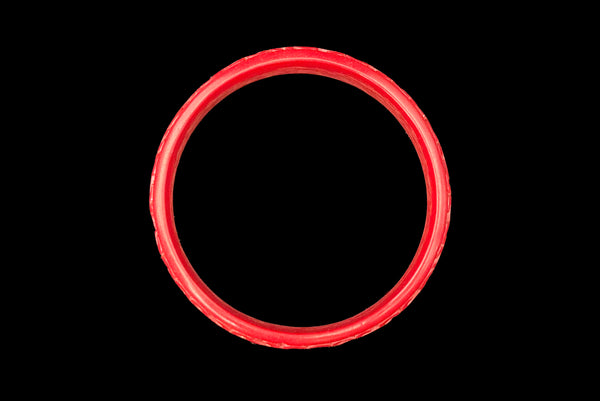 Horizontal top view of 1950s vintage red cinnabar scroll carved lacquered Asian bangle bracelet.