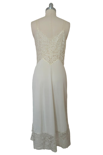 Back view of 1950s vintage white sheer lace sweetheart neckline full slip by Vanity Fair, small to medium.