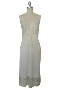 Front view of 1950s vintage white sheer lace sweetheart neckline full slip by Vanity Fair, small to medium.