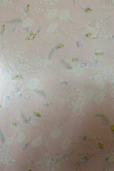 Fabric detail view of 1980s vintage lace trimmed pink floral satin robe by Valentino Intimo, small, medium, large. Showing the green, lavender, and white floral print.