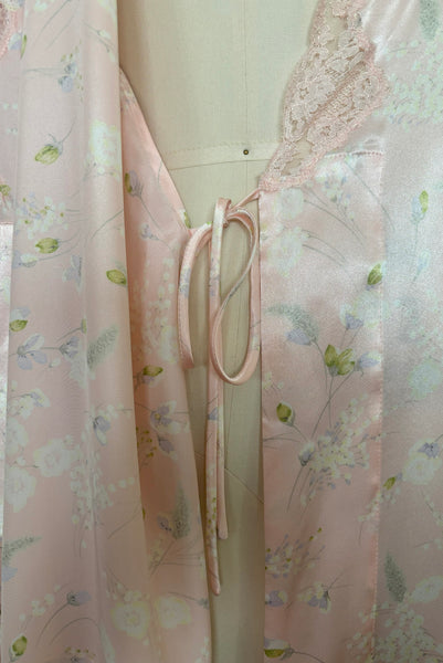 Interior detail view of 1980s vintage lace trimmed pink floral satin robe by Valentino Intimo, small, medium, large. Showing the inner tie closure.